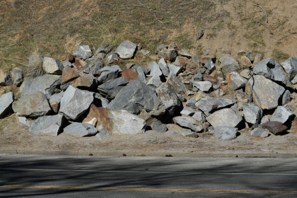 istock Rock Retaining Wall Above Steep Slope and Highway 2194245517