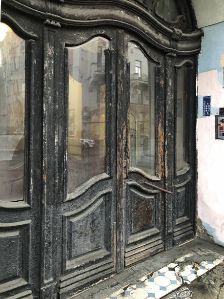 istock An antique front door, peeling black paint 2194245598