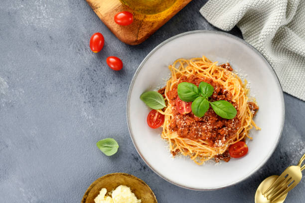 istock spaghetti bolognese with fresh basil leaves 2194249203