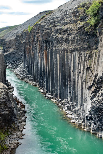 istock Studlagyl Canyon. Egilsstadir. Amazing basaltic rocks. Emerald water. Iceland 2194250800