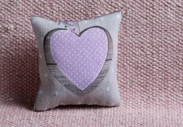 istock Cushion with pink spotted heart 2194251294