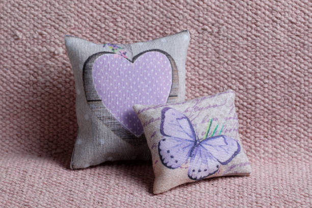 istock Cushions with butterfly and pink heart 2194252826