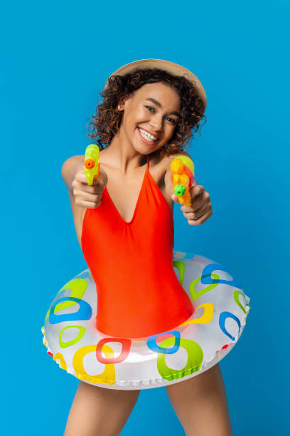 istock Vibrant Summer Fun With Water Guns and Colorful Float 2194253091