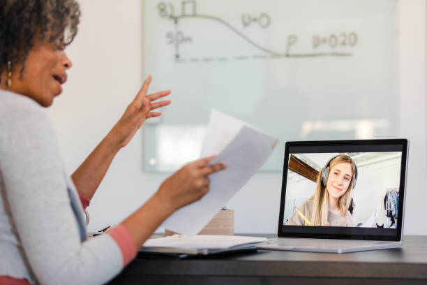 istock Online Tutoring Session: Teacher and Student Connecting via Video Call 2194256268