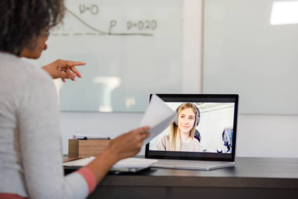 istock Online Tutoring Session: Teacher and Student Connecting via Laptop 2194256273