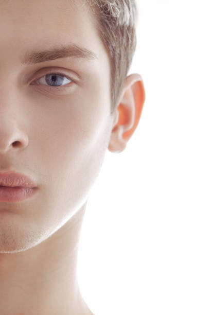 Close-up shot of a man's blue eye and prominent nose