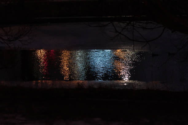 Reflection of light on the water, from a lantern at night. High quality photo