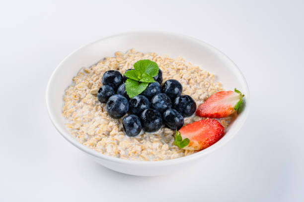 istock Milk porridge prepared for breakfast with blueberries, strawberries 2194262138