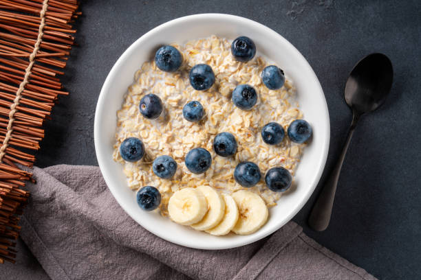 istock Milk porridge prepared for breakfast with blueberries, strawberries 2194262210