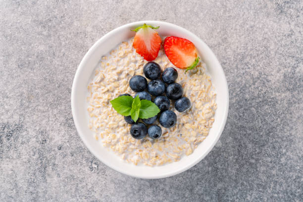 istock Milk porridge prepared for breakfast with blueberries, strawberries 2194262243