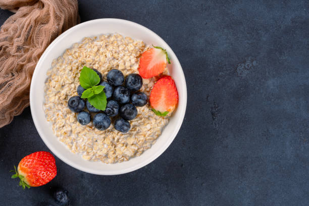 istock Milk porridge prepared for breakfast with blueberries, strawberries 2194262310