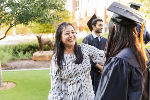 istock Proud Mom Congratulates Daughter at Graduation 2194268878