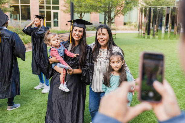 istock Happy Graduate Posing with Family on Campus 2194268918