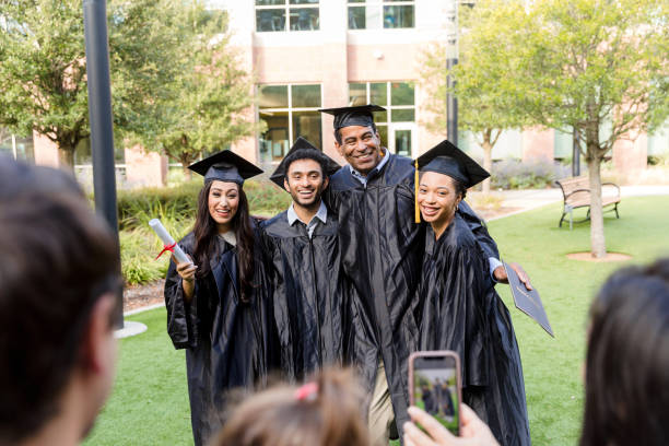 istock Happy Graduates Celebrating Their Success Together 2194268923