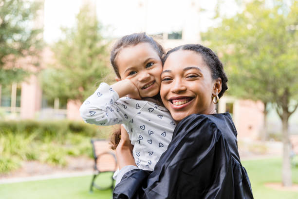 istock Happy Mother and Daughter Hugging Outdoors After Graduation 2194268924
