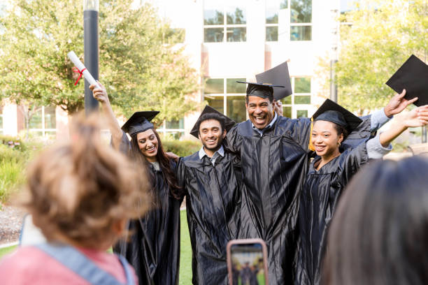istock Happy Graduates Celebrating Together on Campus 2194268926