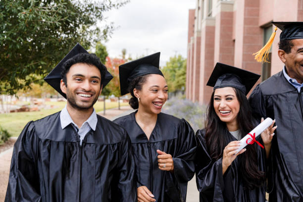 istock Happy Diverse Graduates Walking Together on Campus 2194268945