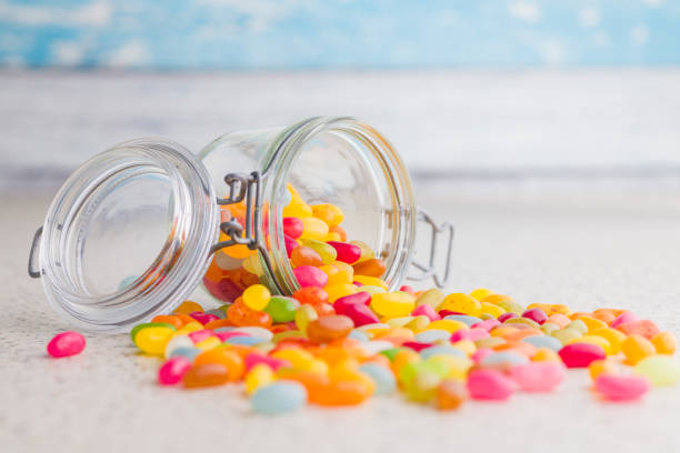 istock Multicolored jelly beans with various flavors in jar on kitchen table. 2194269437