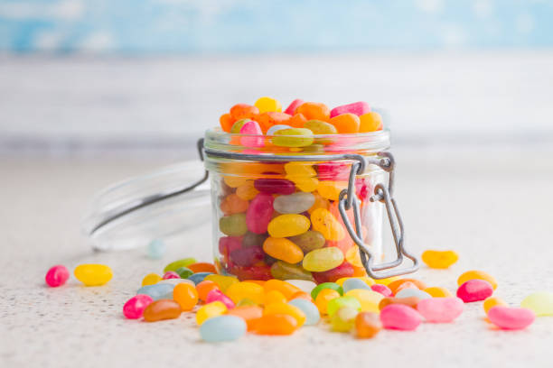 istock Multicolored jelly beans with various flavors in jar on kitchen table. 2194269471