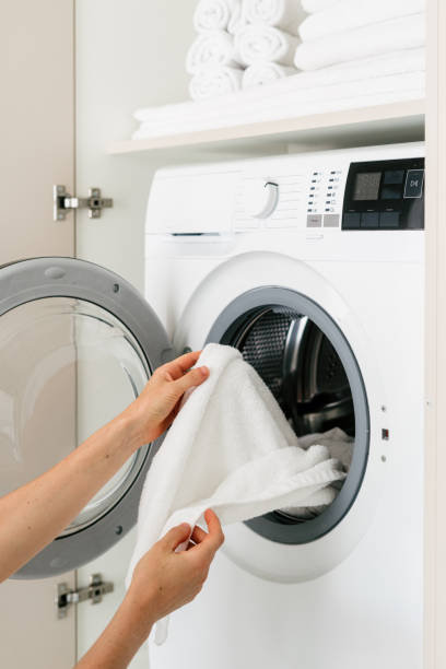istock Modern laundry room with automatic washing machine and dryer in use 2194274403