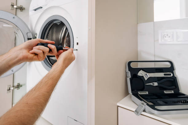 istock Fixing a modern washing machine in a tidy laundry room 2194274586