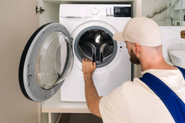 istock Laundry room with modern washing machine in a sleek apartment setting 2194274661
