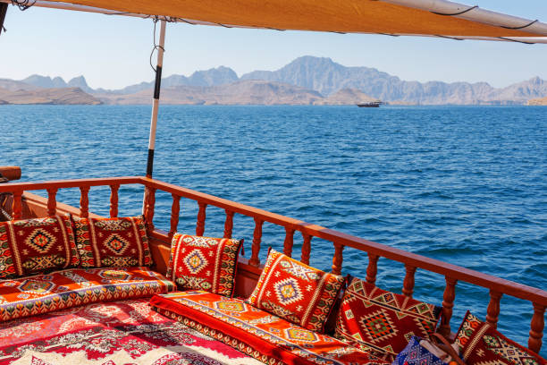 Cruise on a traditional dhow along the stunning fjords and coastline of Khasab, Musandam, Oman Cruise on a traditional dhow along the stunning fjords and coastline of Khasab, Musandam, Oman. High quality photo peninsula stock pictures, royalty-free photos & images
