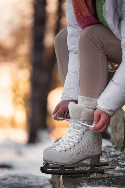 istock A woman preparing for ice skating 2194278275