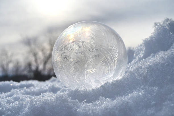istock Frozen bubble in snow - winter weather concept 2194279234