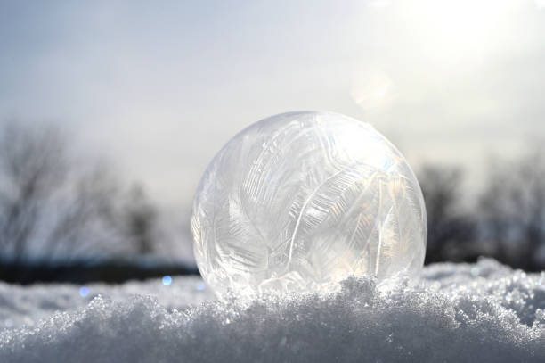 istock Frozen bubble in snow - winter weather concept 2194279236
