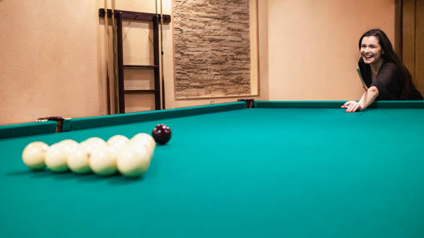 istock Woman play billiards 2194279550