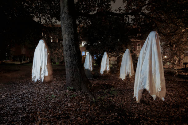 Multiple exposure of ghost in cemetery