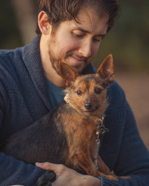 istock Man and His Puppy - Smile 2194280806
