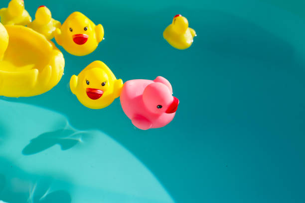 istock Rubber ducks in blue water 2194284386