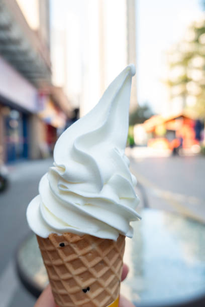 istock hand holding ice cream cone in the outdoor 2194286038