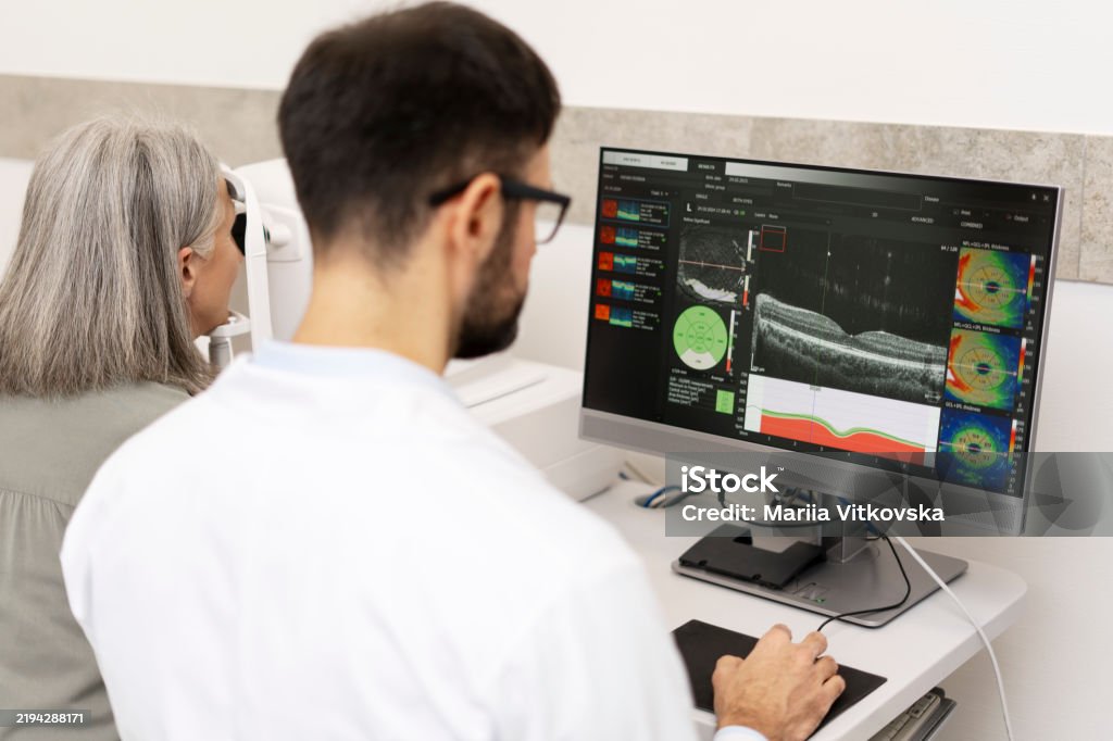 Claps Optical Scan Ophthalmologist Analyzing Optical Coherence Tomography Scan Results On ...