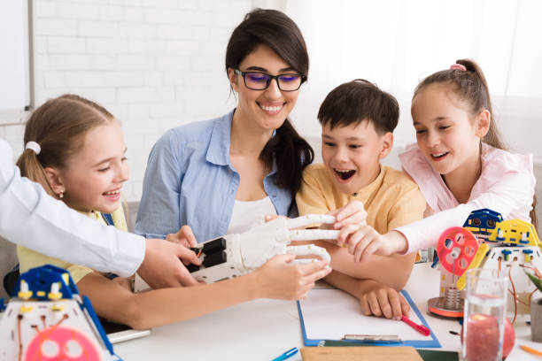 istock Children Learn Robotics With Hands On Activities in a Classroom Setting Guided by an Instructor 2194291440