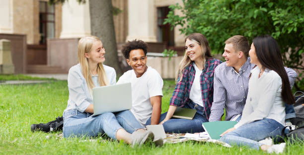istock Break in college. Students talking and resting in campus 2194291743