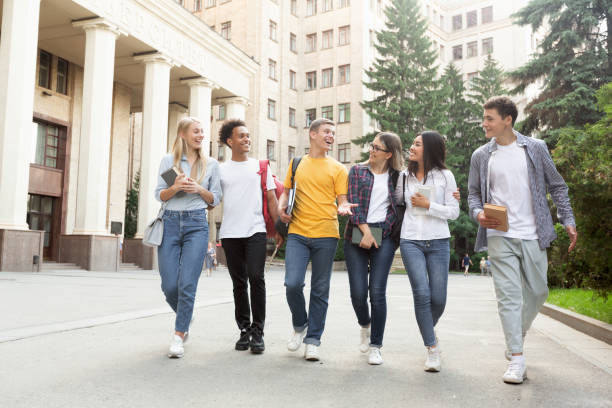 istock Free time of students, teens walking after passing test 2194291744