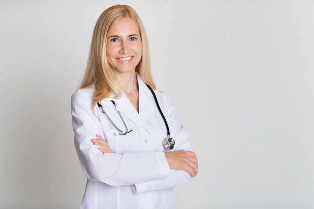 istock Happy Middle-Aged Medical Worker In Uniform With Stethoscope 2194292884