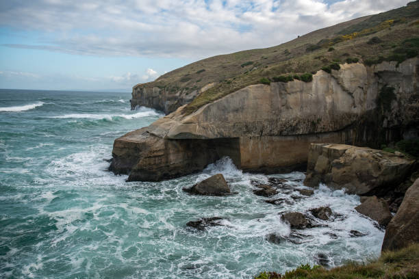 istock Tunnel Beach rock formation with waves under the archway 2194294305