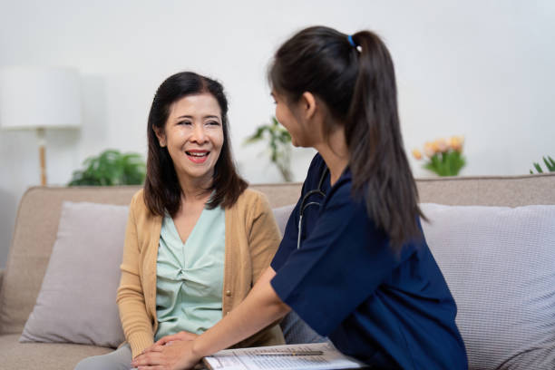 istock Warm-hearted caregiver sharing a joyful moment with elderly patient in a nurturing environment 2194297625