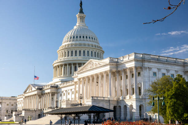 December 30, 2024 - Washington, DC: The morning sun rises on the Capitol with flags flying half-staff following the death of Carter