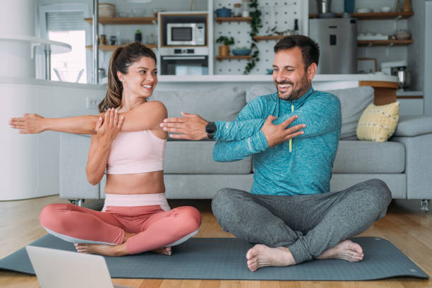istock Couple exercising together at home. 2194299671