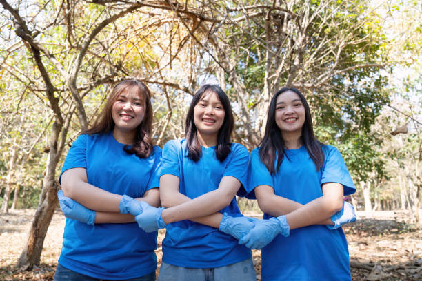 istock Three young volunteers participating in a community cleanup, showcasing teamwork and environmental stewardship 2194300492