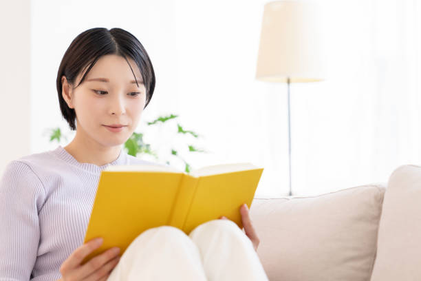 istock asian woman who reads a book, 2194302614