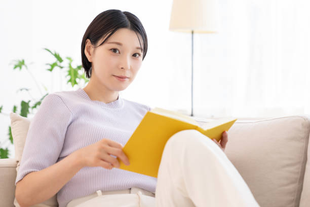 istock asian woman who reads a book, 2194302731