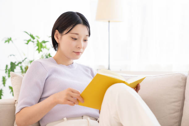 istock asian woman who reads a book, 2194302771