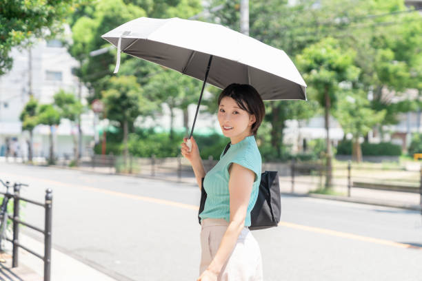 istock attractive asian woman ,parasol 2194302853