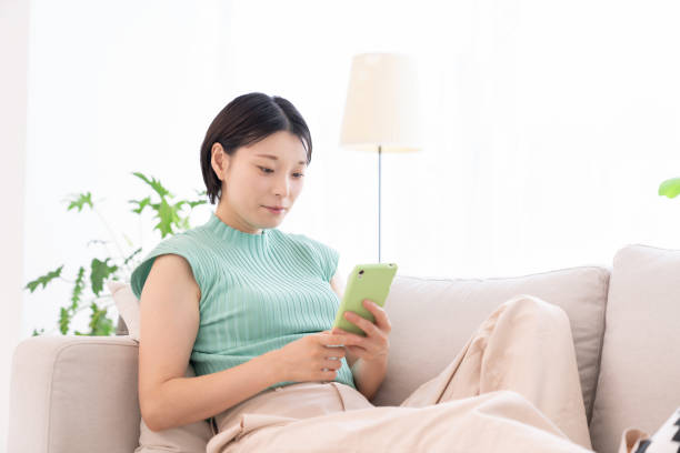 istock Asian woman using a smart phone 2194302862
